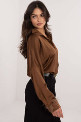 An elegant women's shirt with a classic cut with long sleeve