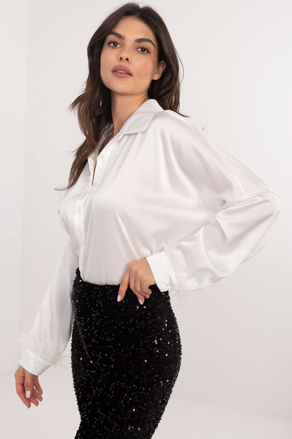 An elegant women's shirt with a classic cut with long sleeve